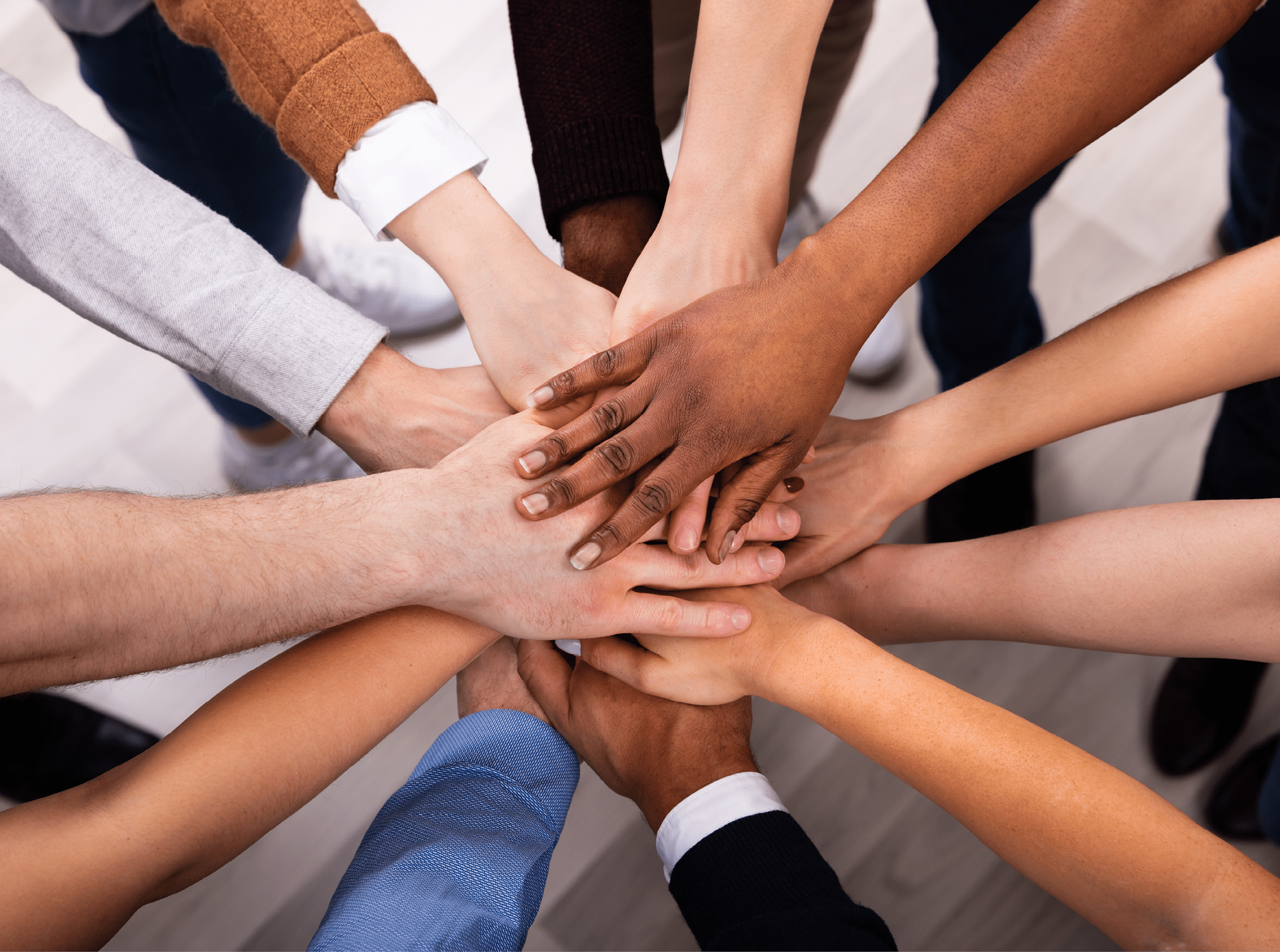 High Angle View Of Multiracial Friend Stacking Hand Together
