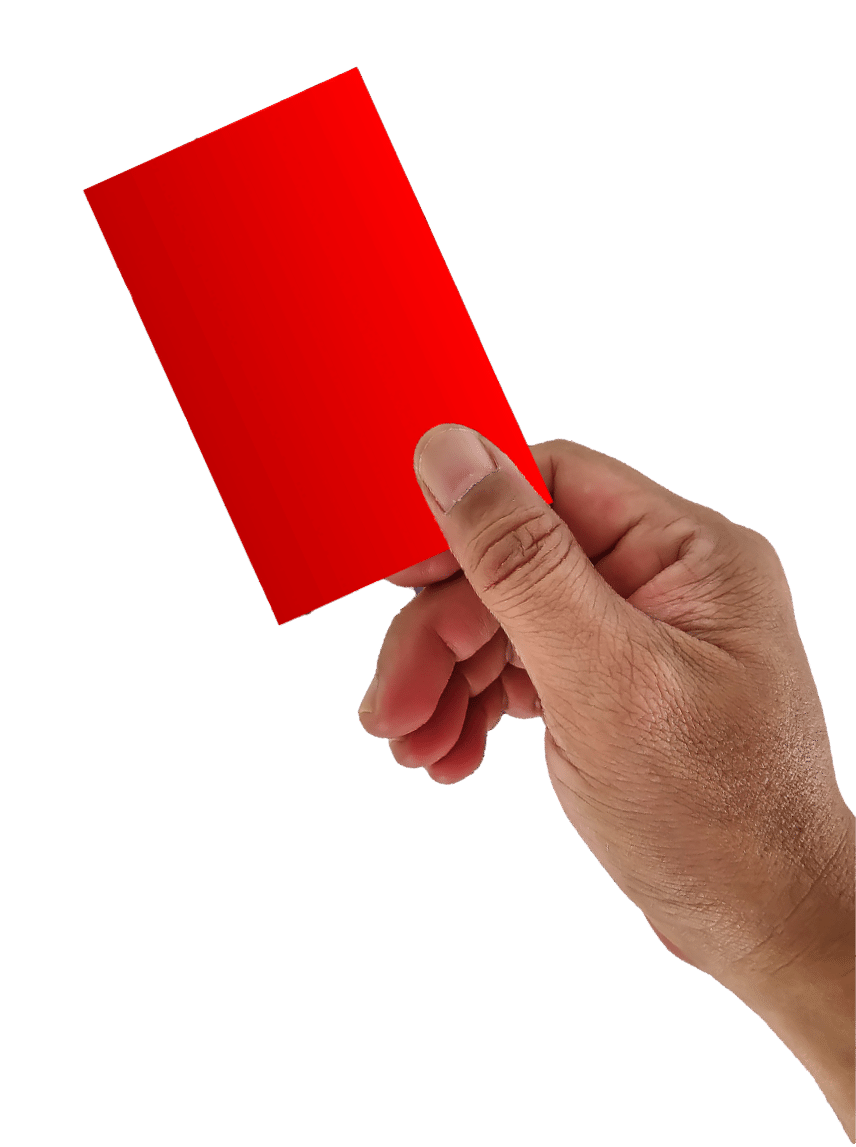 The referee raises his hand and shows a red card in a football match.